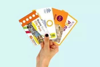 Hand holding best city passes for Rome